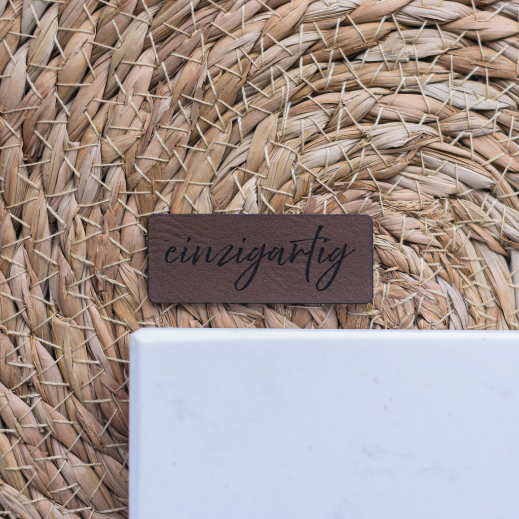 Kunstlederlabel "einzigartig"