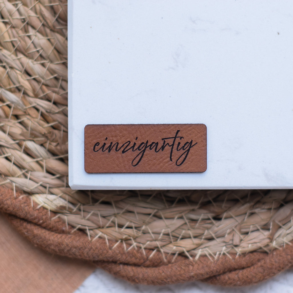 Kunstlederlabel "einzigartig"
