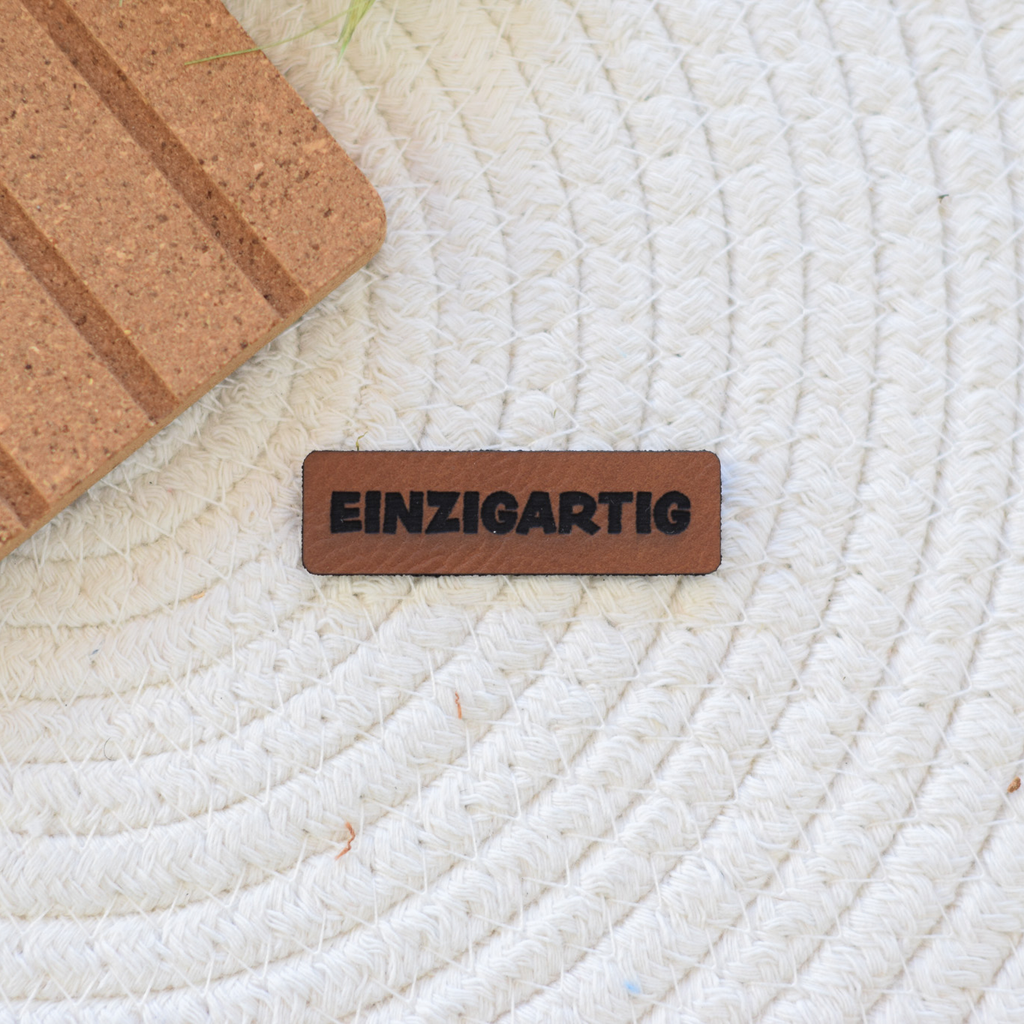 Kunstlederlabel "einzigartig"