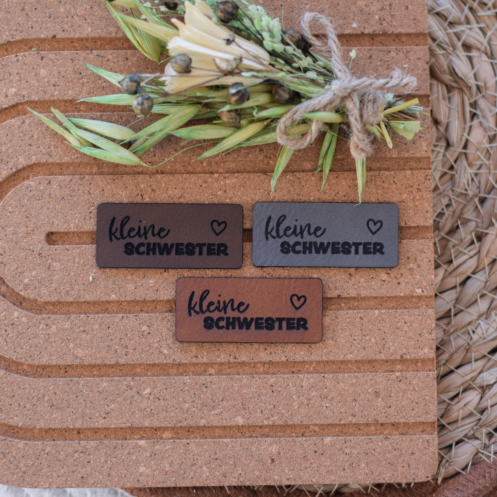 Kunstlederlabel "kleine Schwester"